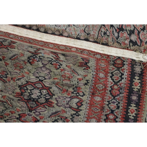 463 - A Kilim rug, floral diamond design, floral spandrel and triple border, 184 x 115cm