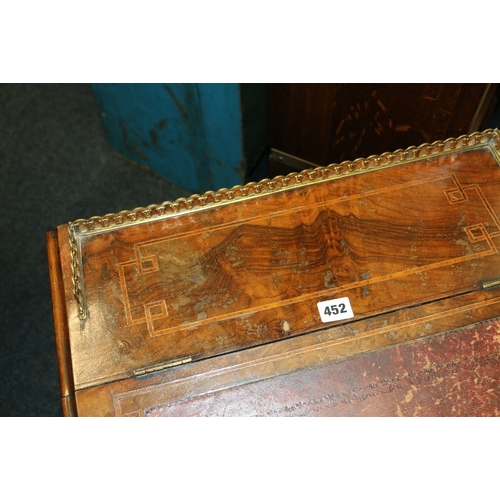 452 - Victorian walnut Davenport desk with pierced brass gallery raised on scroll supports, 81cm tall