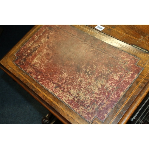 452 - Victorian walnut Davenport desk with pierced brass gallery raised on scroll supports, 81cm tall