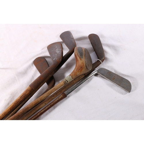 209 - Six hickory shafted golf clubs including Ben Sawyers Benny putter,Mussleburgh iron etc.