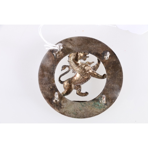 429 - Scottish white metal badge with plain quoit and central rampant lion, possibly Black Watch, four lug... 