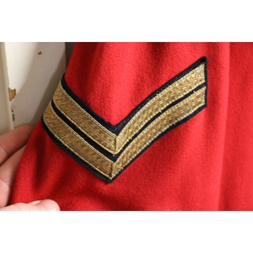 525 - British Army mess dress scarlet red tunic with Ubique bullion wire lapel badges, a waistcoat and a p... 