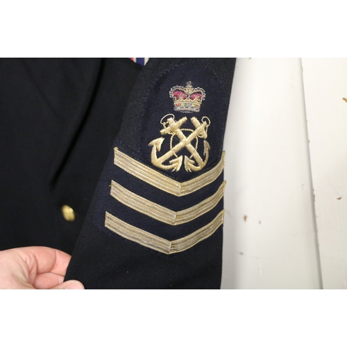 545 - British Royal Navy dress uniform jacket having A Fleming and Co of Portsmouth label with brass naval... 