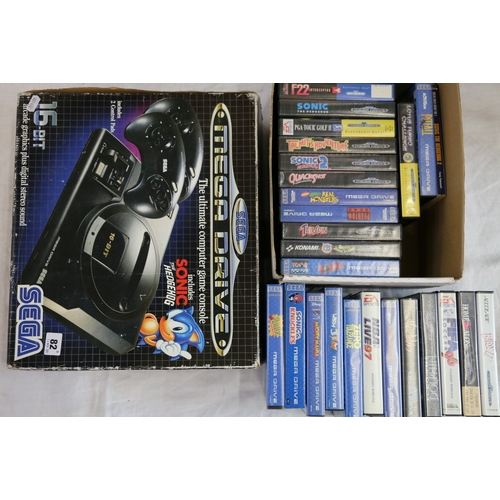 82 - Sega Mega Drive 16 bit game console with a selection of games including Worms, Sonic, Sonic 2, Ariel... 