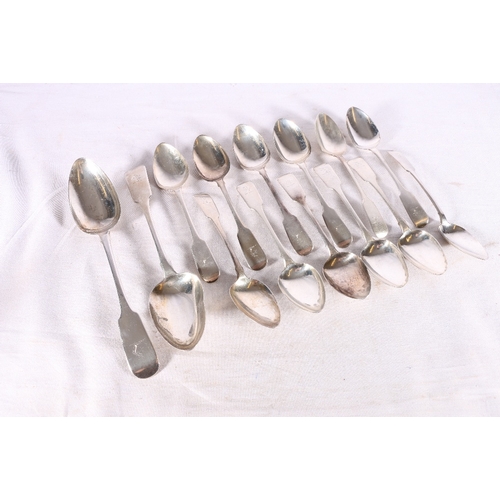 56 - A pair of Irish silver rat tail table spoons and twelve matching dessert spoons of fiddle pattern be... 