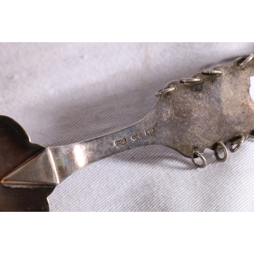 81 - Swedish Sami style silver cake slice decorated with incised reindeer, sleigh and ski designs, makers... 