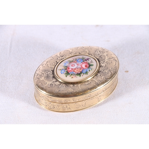 85 - French style gilt metal patch box with allover engraved foliate scroll decoration and on set floral ... 