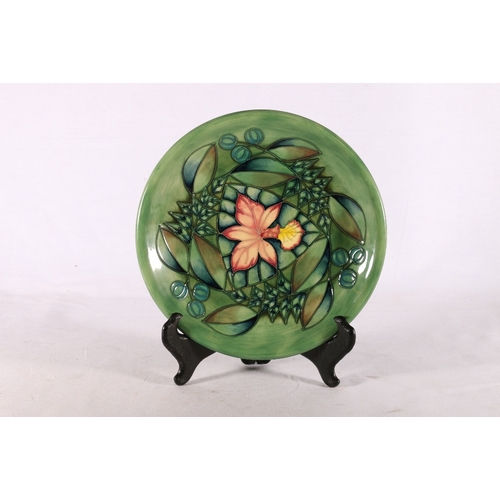 244 - Moorcroft floral design plate, conjoined WM monogram to reverse and signed with initials SA, 26cm di... 