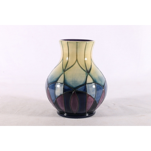 246 - Modern Moorcroft baluster shaped vase with geometric design in purple, blue and green, signed with i... 