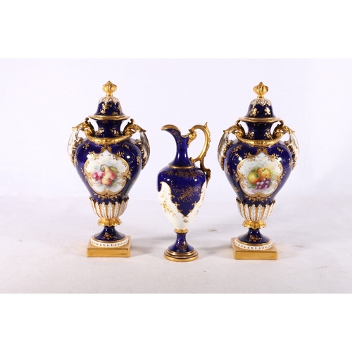 259 - Pair of Royal Worcester twin handled porcelain urns with painted floral vignettes by Hawkins on a co... 