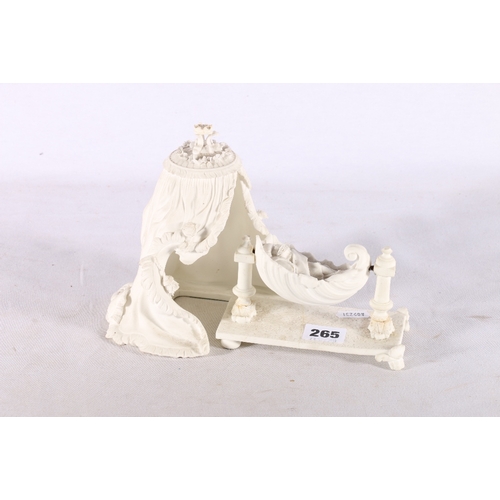 265 - Grainger Worcester bisque porcelain group of a baby in cradle under canopy, stamped Graingers Worces... 