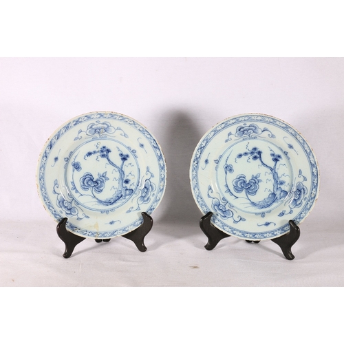 266 - Pair of antique English delft tin glazed plates decorated with tree pattern, 23cm diameter