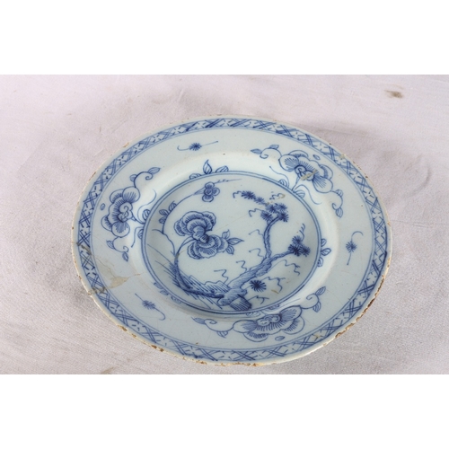 266 - Pair of antique English delft tin glazed plates decorated with tree pattern, 23cm diameter