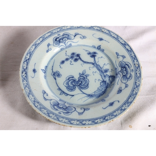 266 - Pair of antique English delft tin glazed plates decorated with tree pattern, 23cm diameter