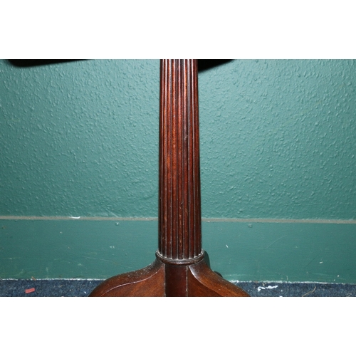 541 - 19th century mahogany circular tilt top table raised on reeded column with three snake legs and pad ... 