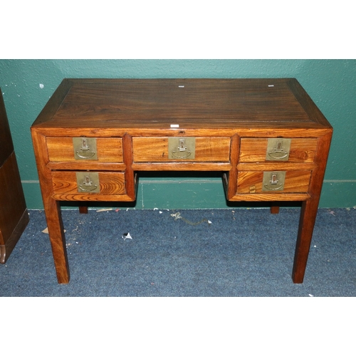 553 - Early 20th century Oriental hardwood desk, the rectangular crossbanded top above an arrangement of f... 