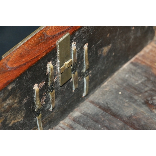 553 - Early 20th century Oriental hardwood desk, the rectangular crossbanded top above an arrangement of f... 