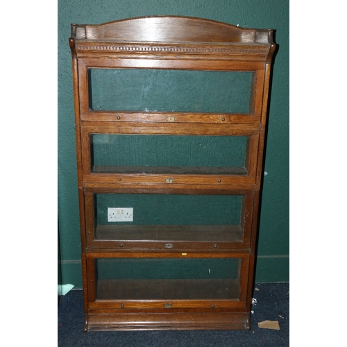 554 - Early 20th century Lebus oak stacking bookcase of four sections with gallery back and dental work fr... 