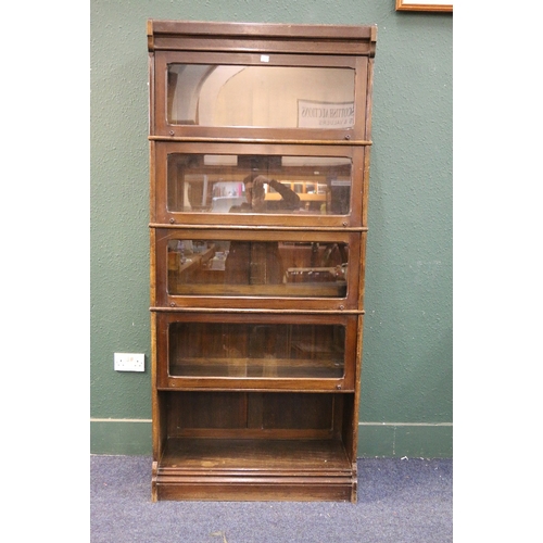 555 - Early 20th century mahogany stacking bookcase, 200cm tall