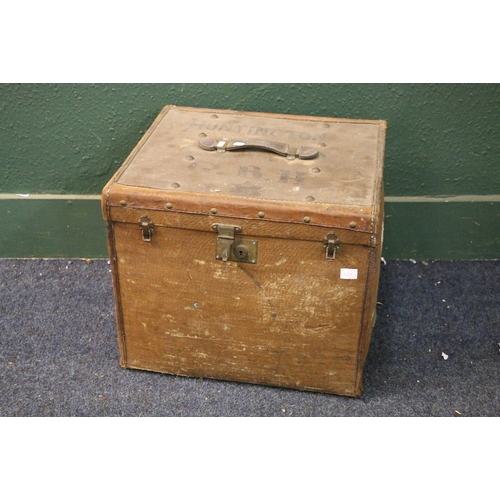 556 - Early 20th century leather and canvas travel case of cube form, the interior bearing a red label for... 