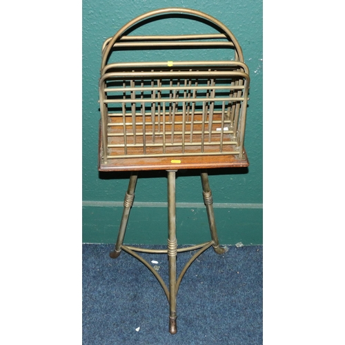 559 - Unusual oak and brass revolving magazine rack raised on brass stand stamped 