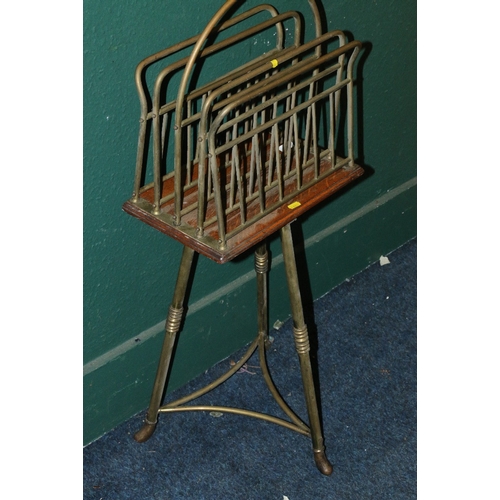 559 - Unusual oak and brass revolving magazine rack raised on brass stand stamped 