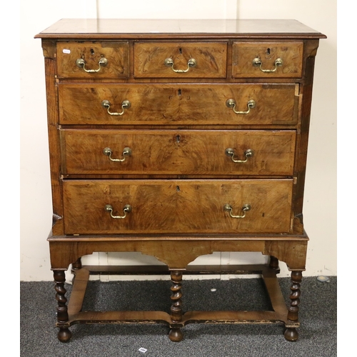 564 - Antique figured walnut chest on stand, the crossbanded rectangular top with moulded edge above three... 