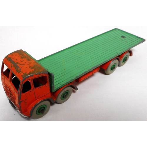 119 - Dinky. Foden flatback lorry. 2nd cab. Orange/green. Average condition. Un-boxed.