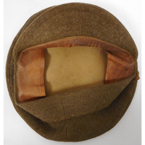 85 - WW I army khaki cap. With G.S. chinstrap buttons, Appears un-used but grubby. Some moth. No badge pi... 