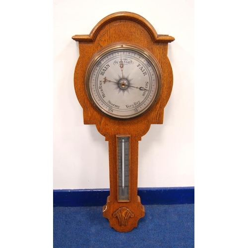 242 - Late 19th century or early 20th century oak barometer, the moulded arched pediment over brushed meta... 