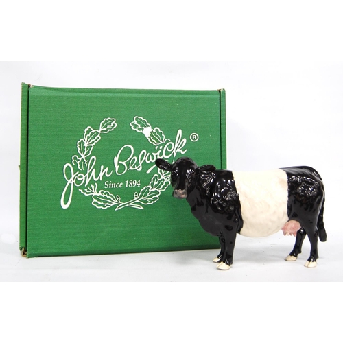 243 - Beswick model of a Belted Galloway cow, marks to the underside, boxed, 21cm wide and 14cm high.