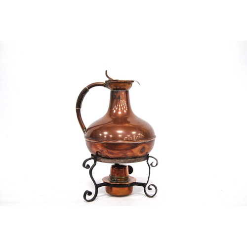 246 - 19th century Aesthetic copper jug on stand with scrolling legs over burner, 21cm high.