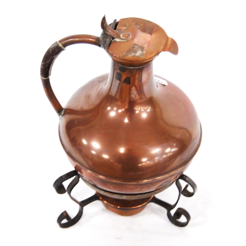 246 - 19th century Aesthetic copper jug on stand with scrolling legs over burner, 21cm high.