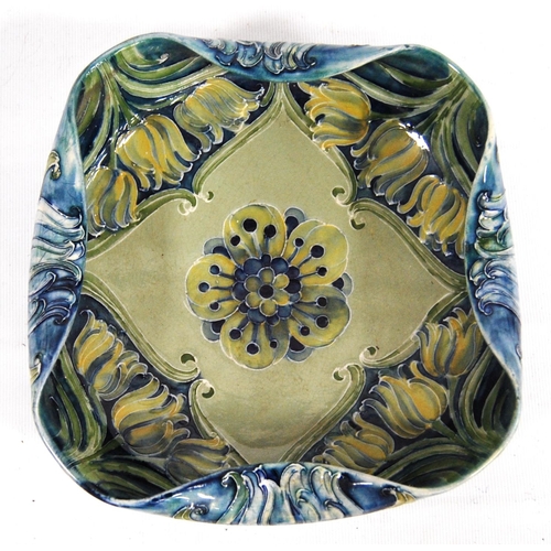 266 - Moorcroft Florian bowl for Liberty with blue glaze, folded-over rim, marks to the base, 21cm wide; t... 