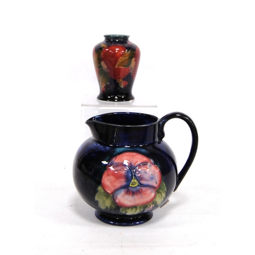 268 - Small Moorcroft vase decorated with fruit over blue ground, signed to the base, 9cm high; together w... 