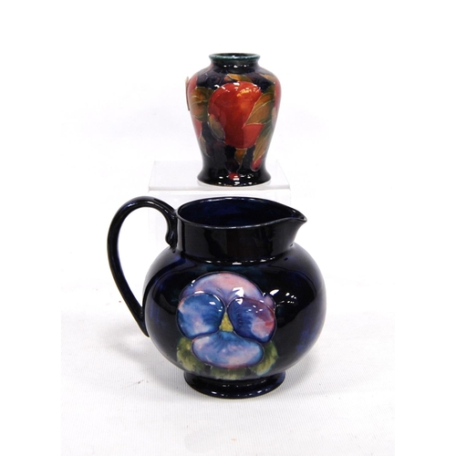 268 - Small Moorcroft vase decorated with fruit over blue ground, signed to the base, 9cm high; together w... 