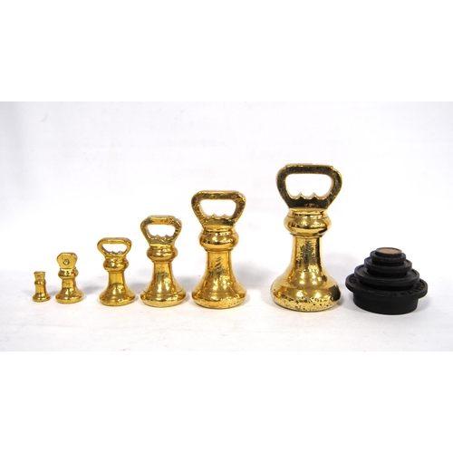 271 - Set of six Avery brass graduated weights, including a set of Victor stacking weights, 18cm high.