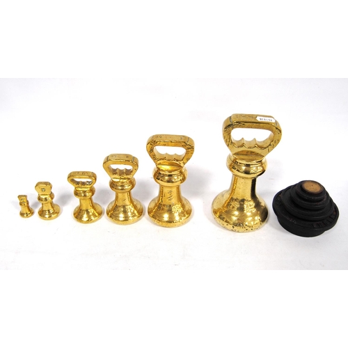 271 - Set of six Avery brass graduated weights, including a set of Victor stacking weights, 18cm high.