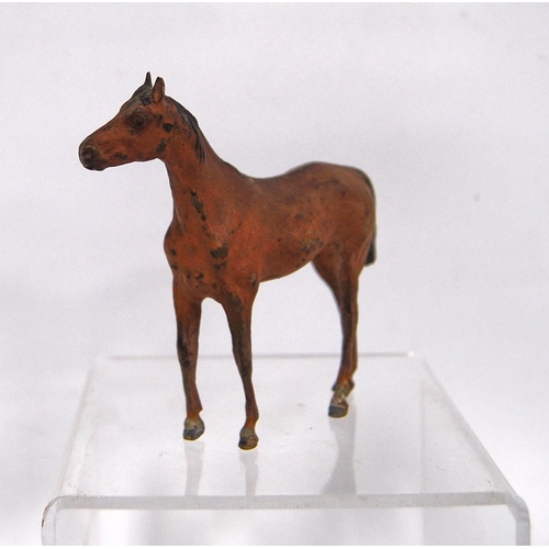 279 - Cold painted bronze model of a horse, unsigned, 8.5cm high.