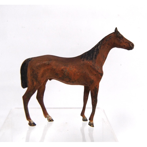 279 - Cold painted bronze model of a horse, unsigned, 8.5cm high.