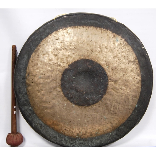 280 - Large oriental bronze gong, 65cm diameter.