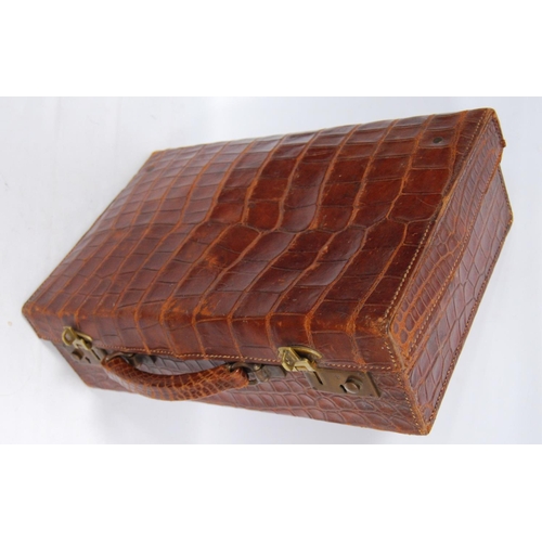 285 - Vintage crocodile skin case with brass locks, monogrammed 'M.B.', 38cm wide, 12cm high and 25cm deep... 