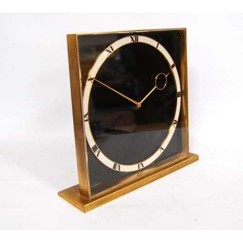 288 - German Art Deco brass desk clock with black face, white chapter ring and eight day clockwork movemen... 