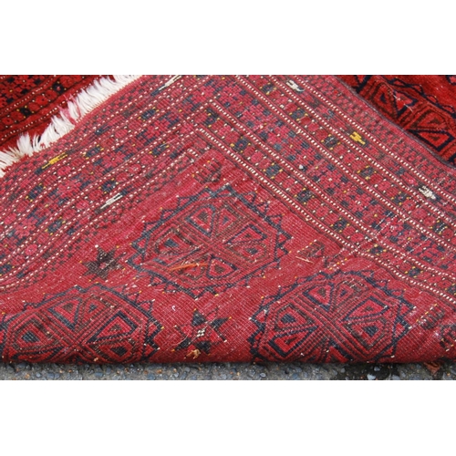 299 - Rug with three rows of seven guls over red ground, multiple border, multiple border, 171cm x 108cm.