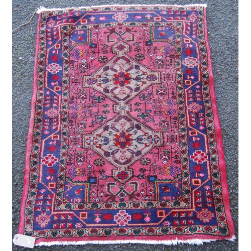 301 - Hamadan rug with two central medallions over floral pink ground, triple border, 120cm x 95cm.