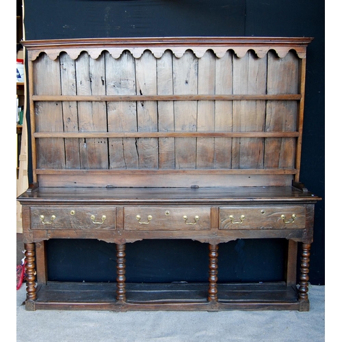 304 - 19th century oak dresser with projected moulded cornice over arched apron, open shelves, moulded rec... 