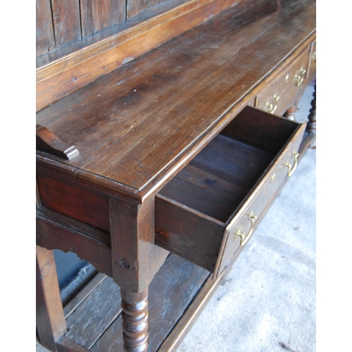 304 - 19th century oak dresser with projected moulded cornice over arched apron, open shelves, moulded rec... 