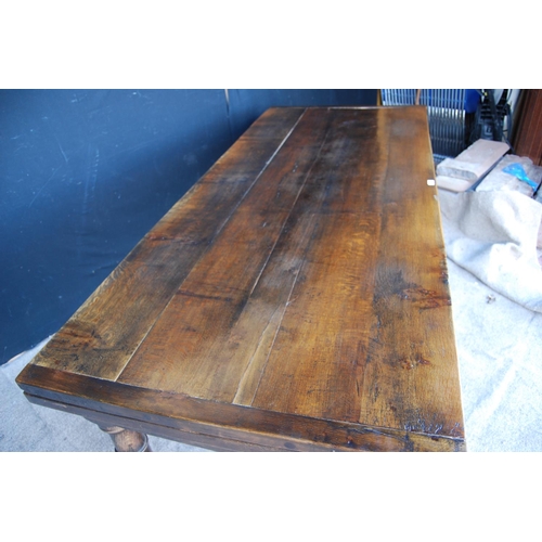 305 - 18th century style refectory table with rectangular plank top enclosing leaves, raised on block and ... 