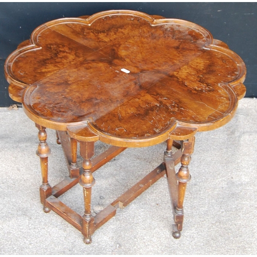 311 - Queen Anne style burr walnut gate-leg table, the scalloped drop-flap top raised on baluster turned l... 