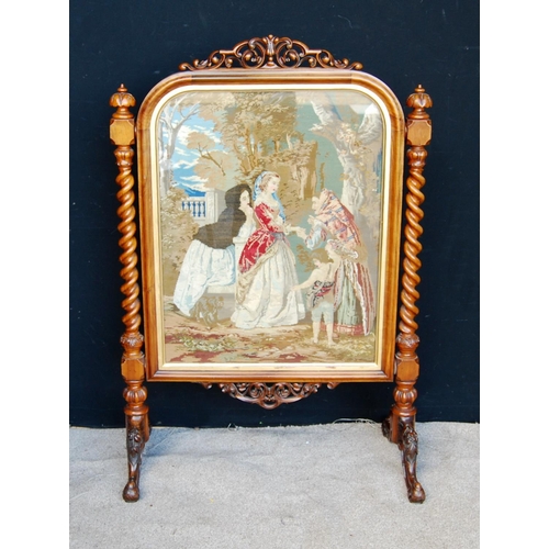 316 - Victorian walnut framed firescreen mounted by pierced scroll work, moulded rounded rectangular frame... 